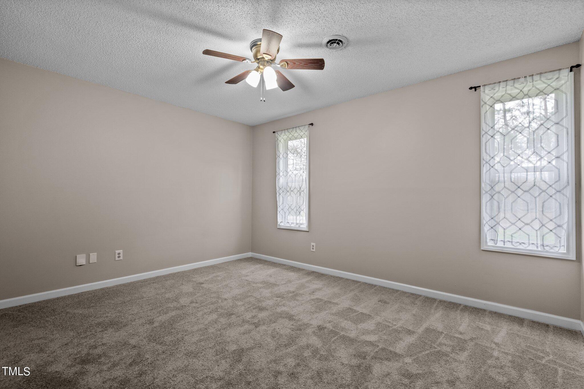 1129 Bermuda Run Knightdale, NC 27545 - Photo 17 of 34 a view of an empty room with a window