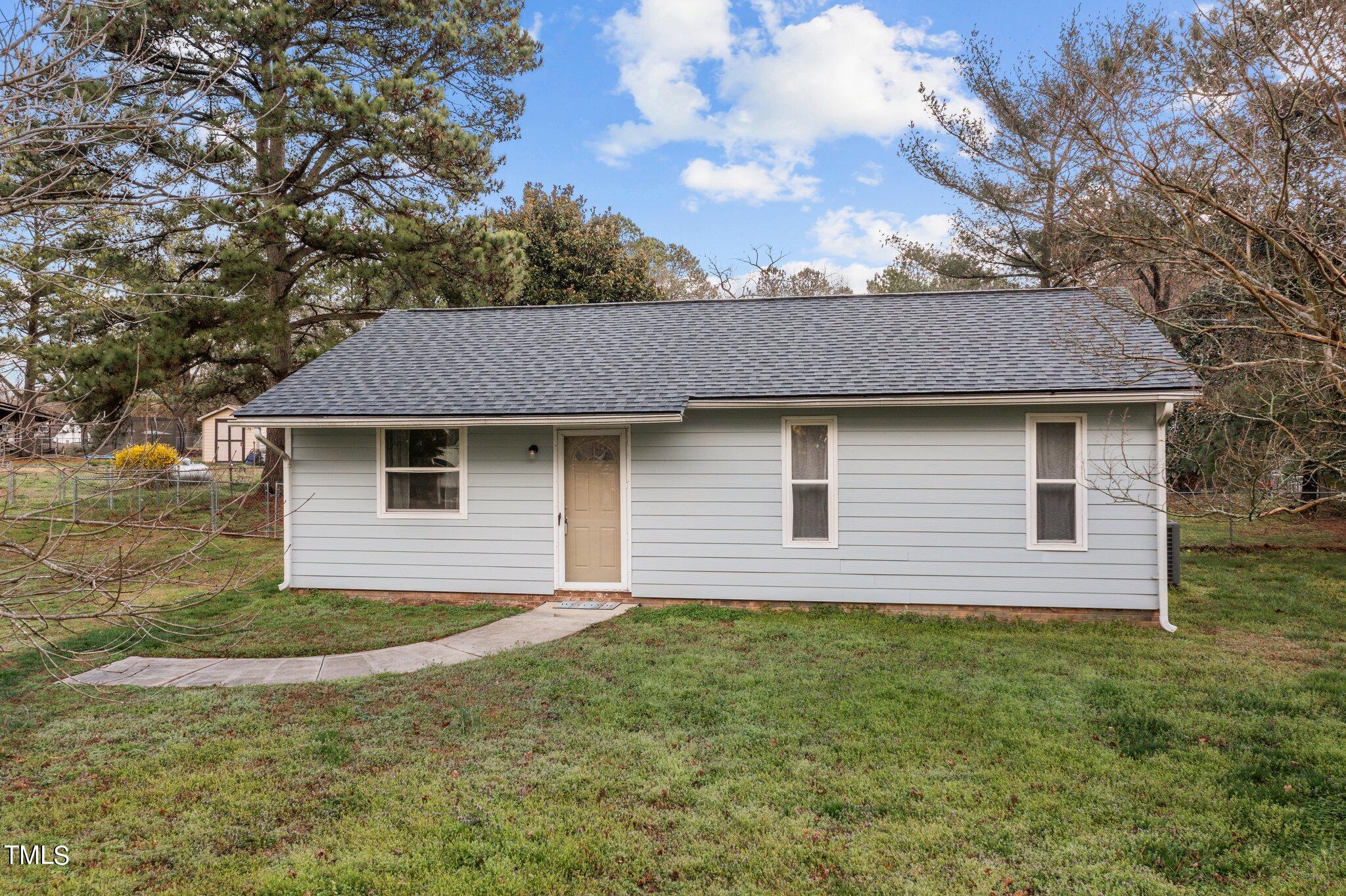 1129 Bermuda Run Knightdale, NC 27545 - Photo 2 of 34 a front view of a house with garden