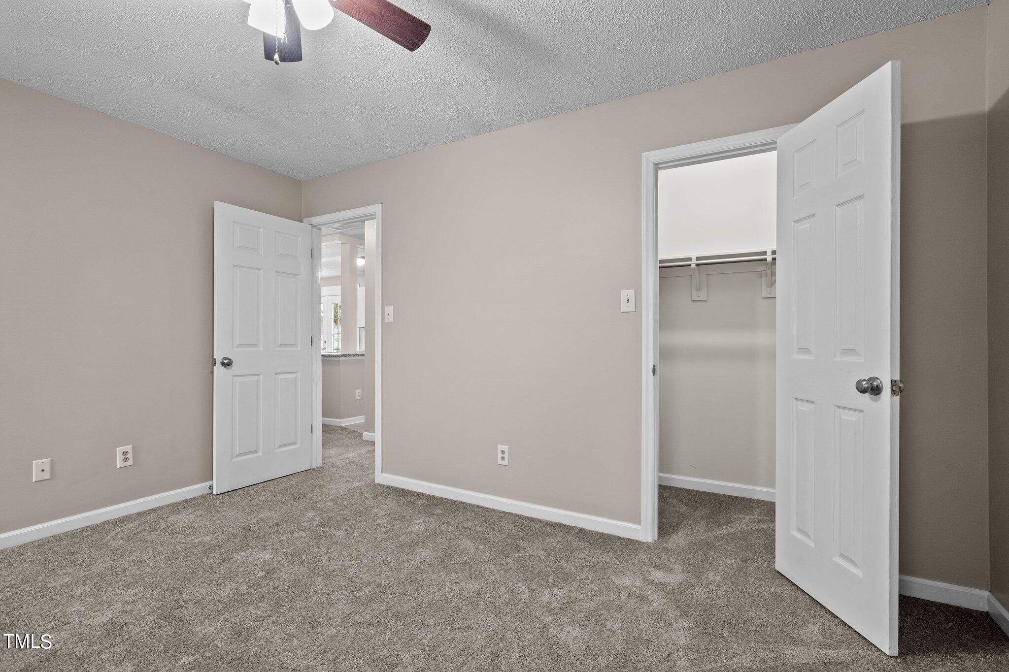 1129 Bermuda Run Knightdale, NC 27545 - Photo 20 of 34 a view of an empty room and chandelier fan