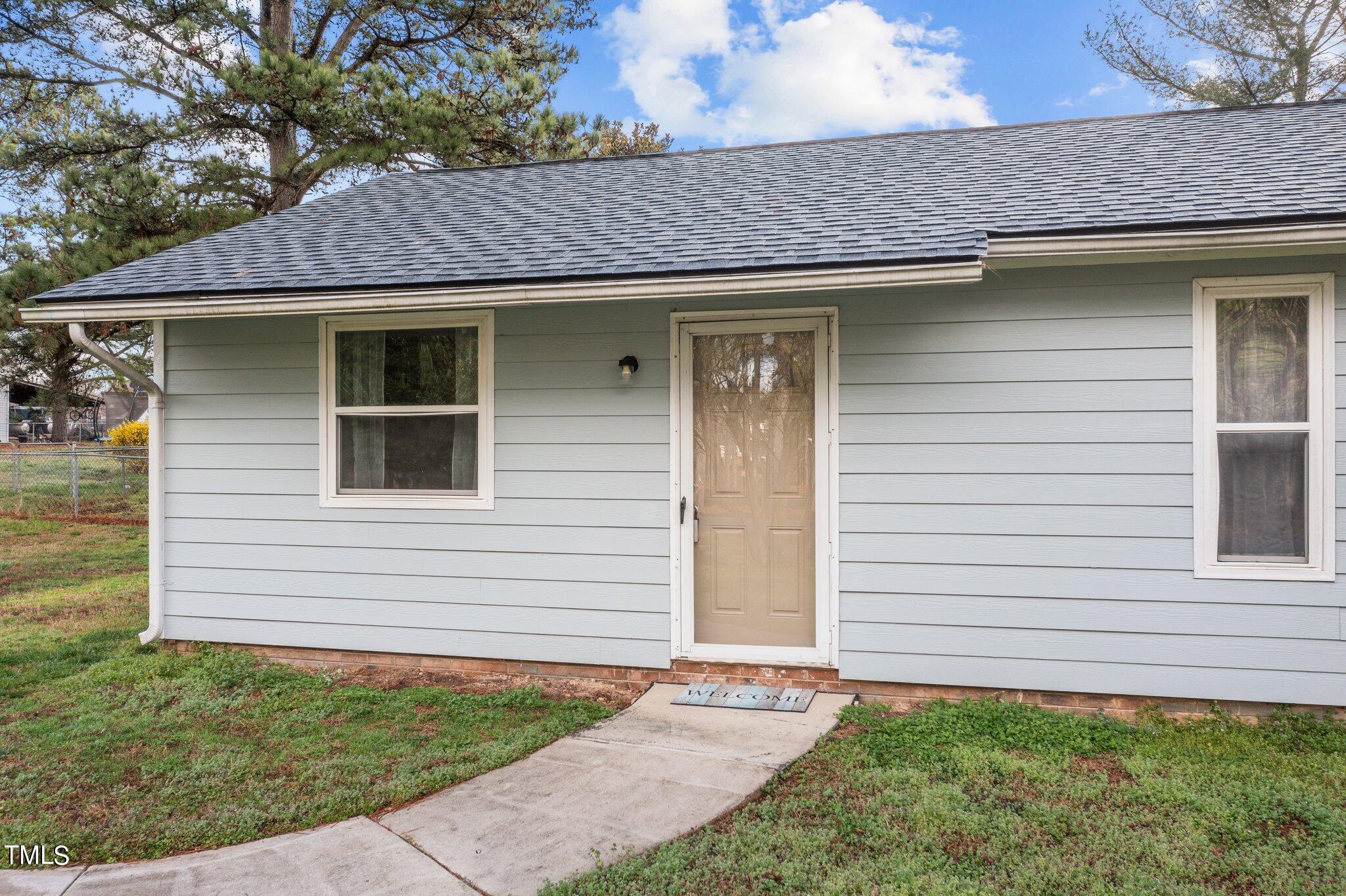 1129 Bermuda Run Knightdale, NC 27545 - Photo 3 of 34 a front view of a house with plants