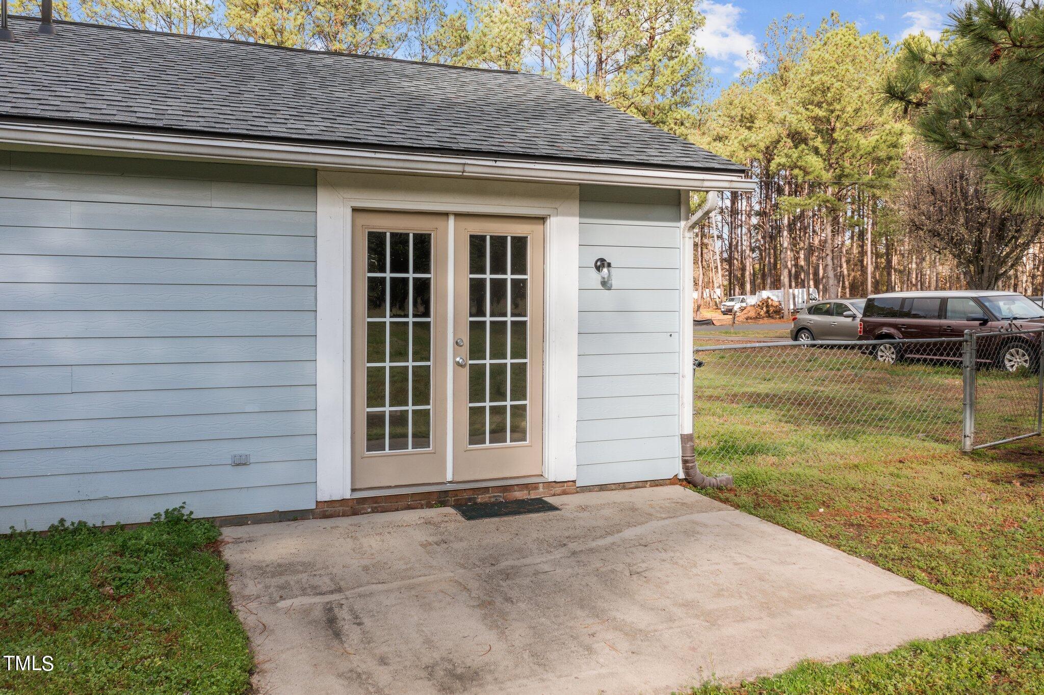1129 Bermuda Run Knightdale, NC 27545 - Photo 30 of 34 a view of a house with a yard and garage