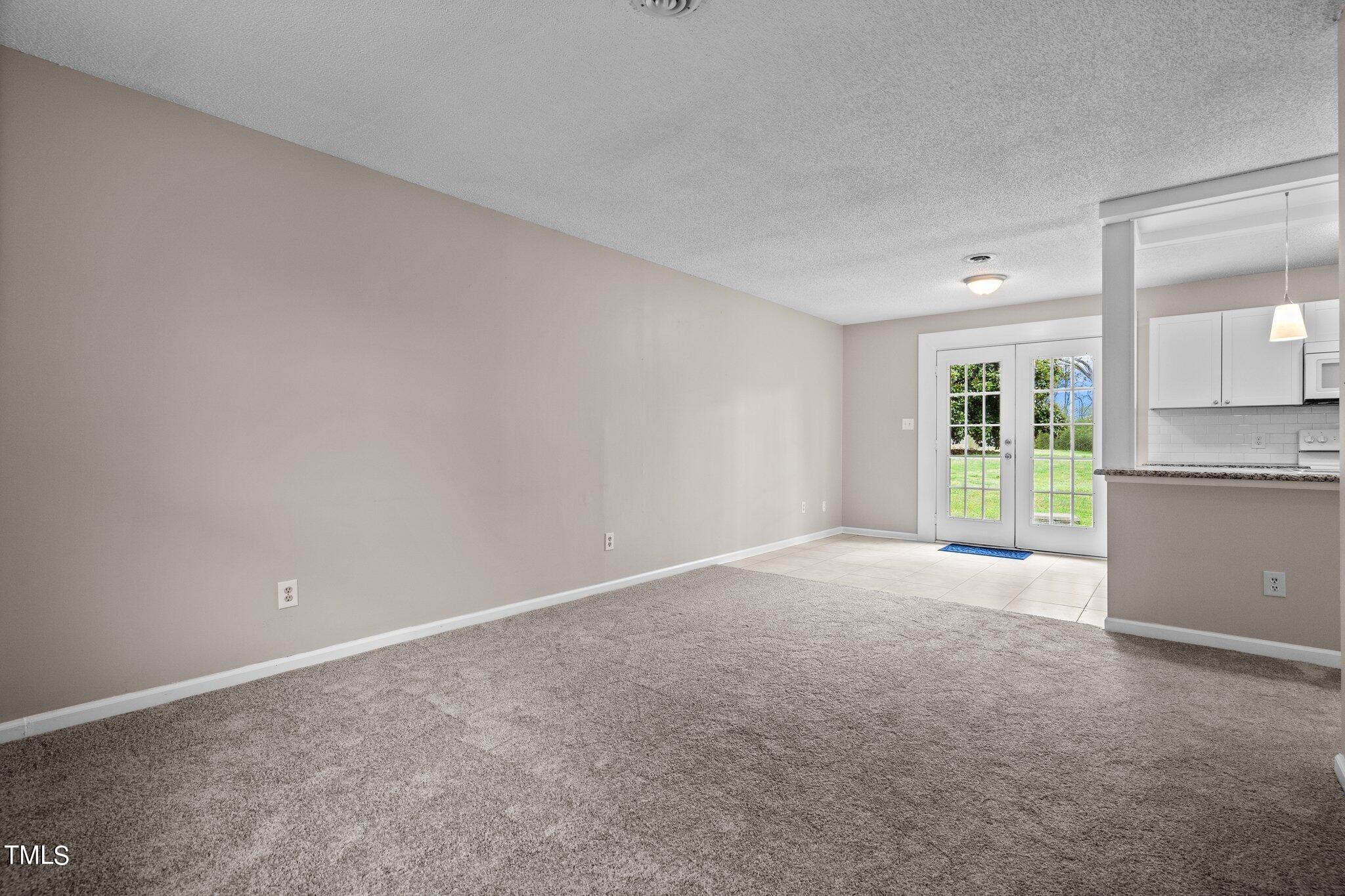1129 Bermuda Run Knightdale, NC 27545 - Photo 4 of 34 a view of a big room with a kitchen