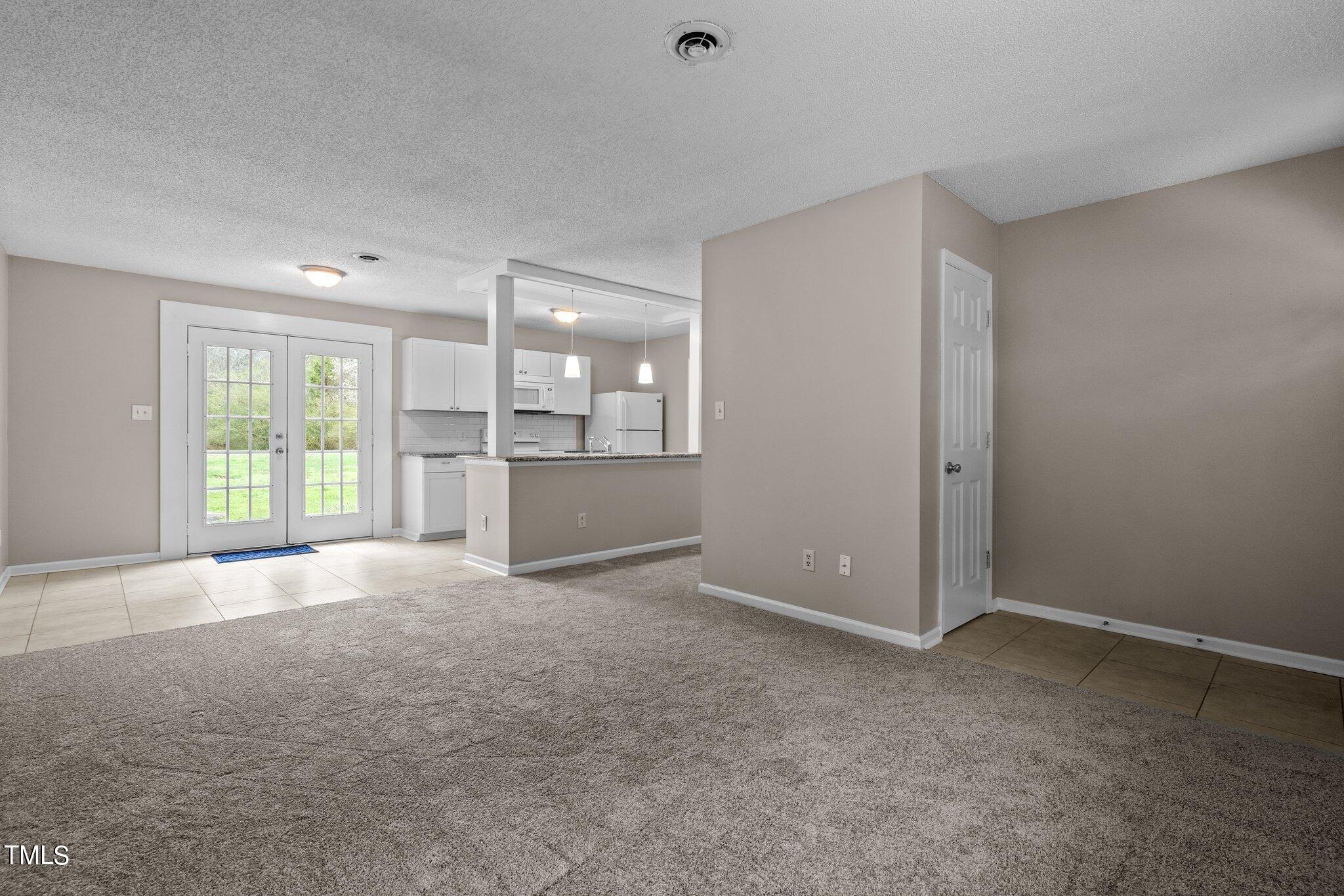 1129 Bermuda Run Knightdale, NC 27545 - Photo 6 of 34 a view of an empty room with a window