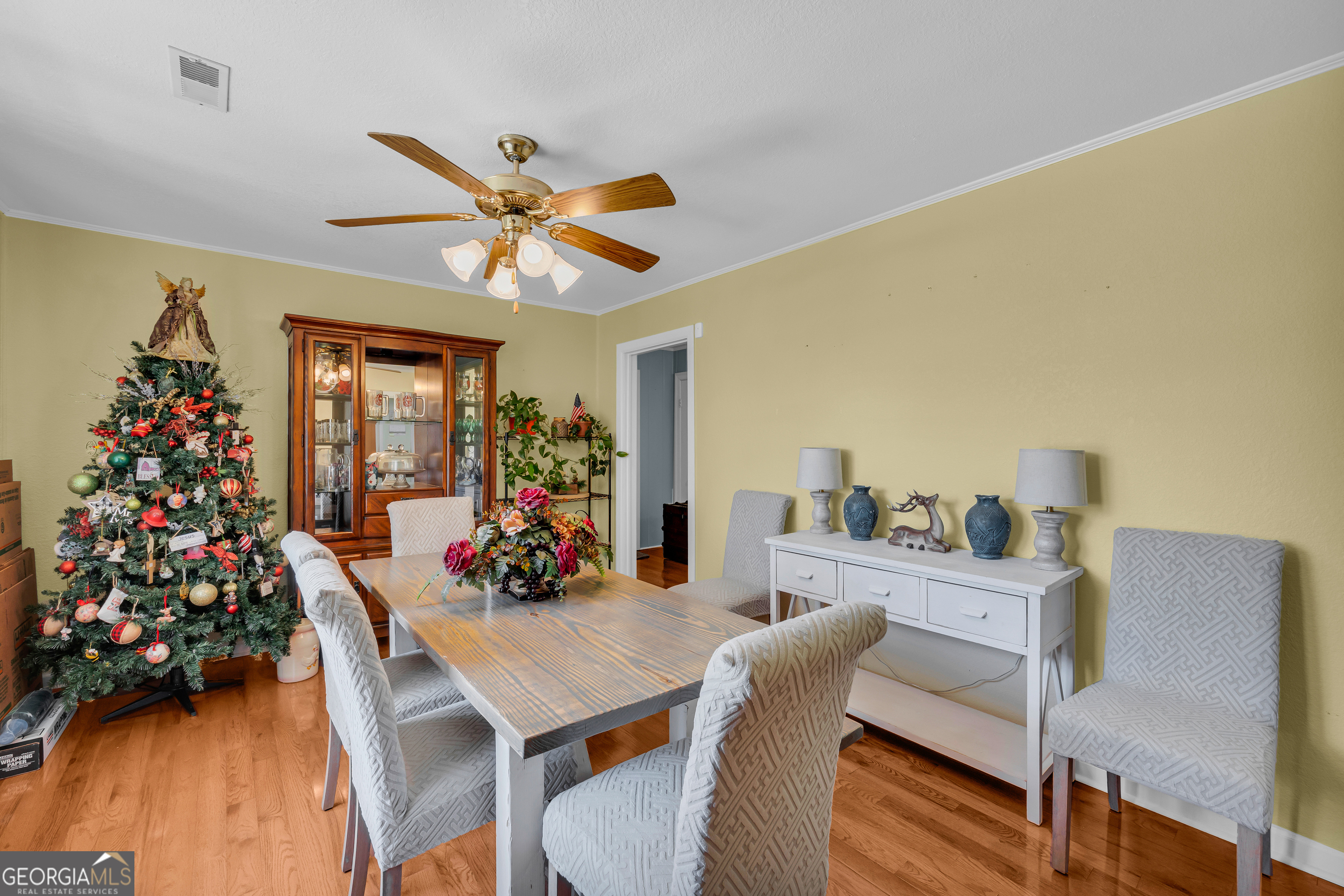 88 Maurice Way Lavonia, GA 30553 - Photo 12 of 65 a view of a dining room with furniture and wooden floor