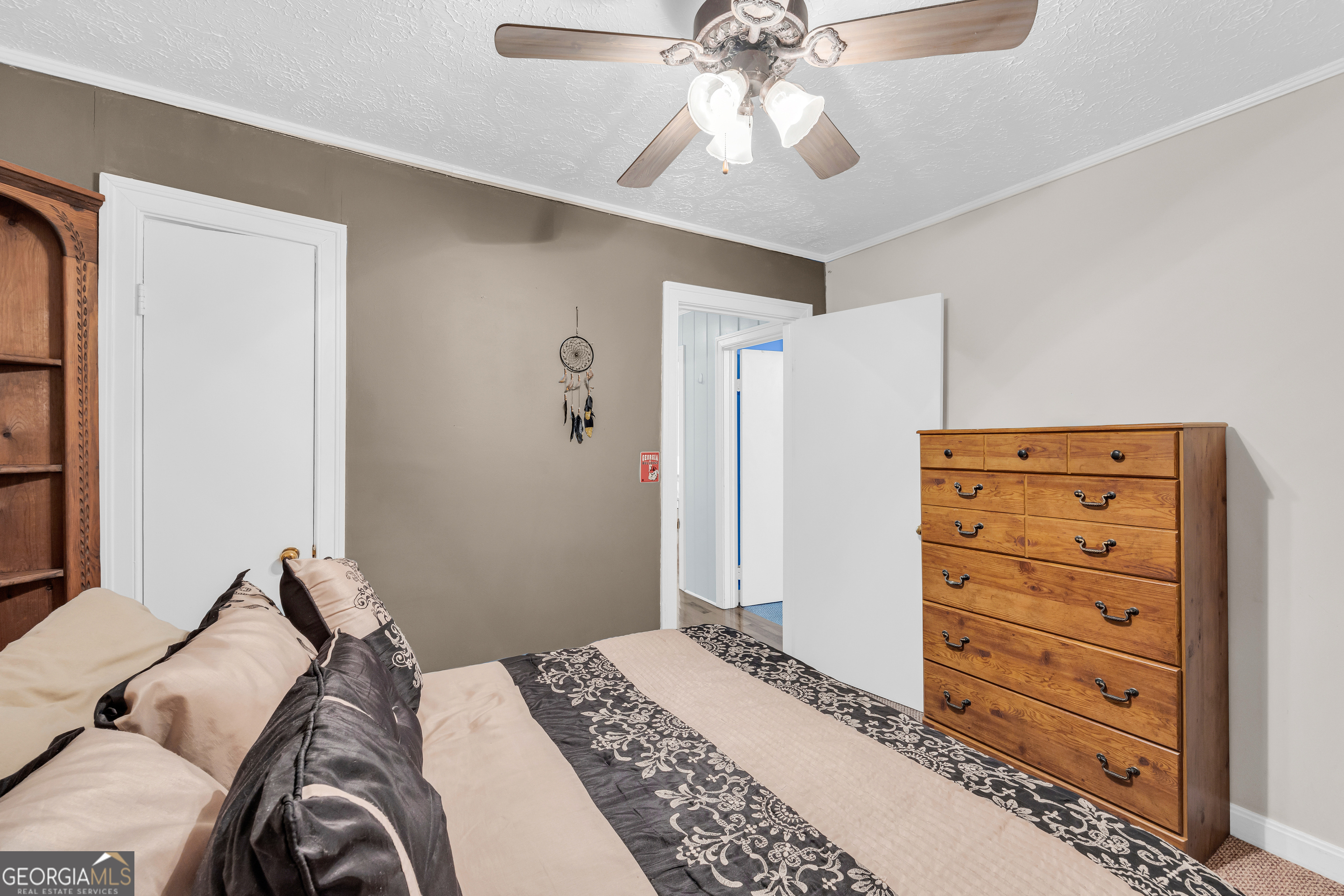 88 Maurice Way Lavonia, GA 30553 - Photo 17 of 65 a bedroom with a bed and a chandelier