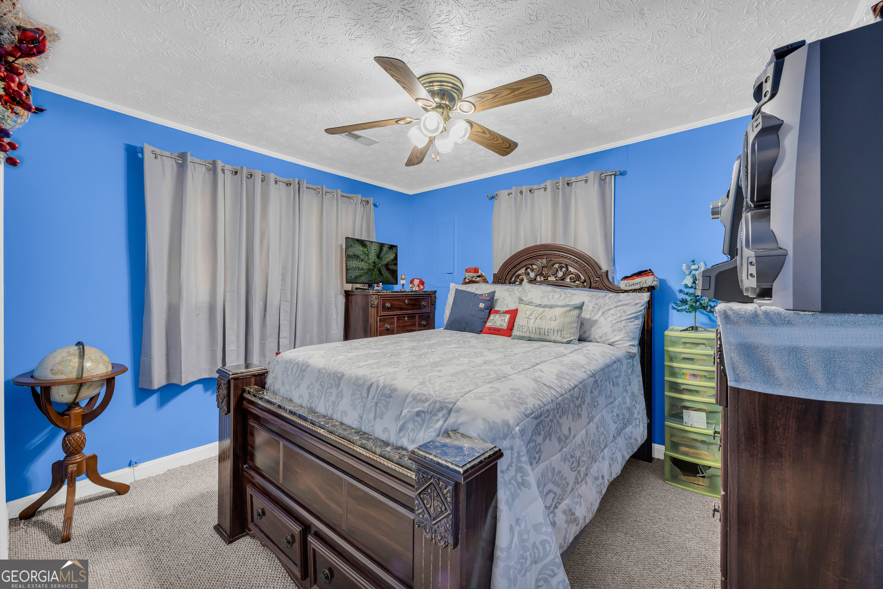 88 Maurice Way Lavonia, GA 30553 - Photo 18 of 65 a bedroom with bed and wooden floor
