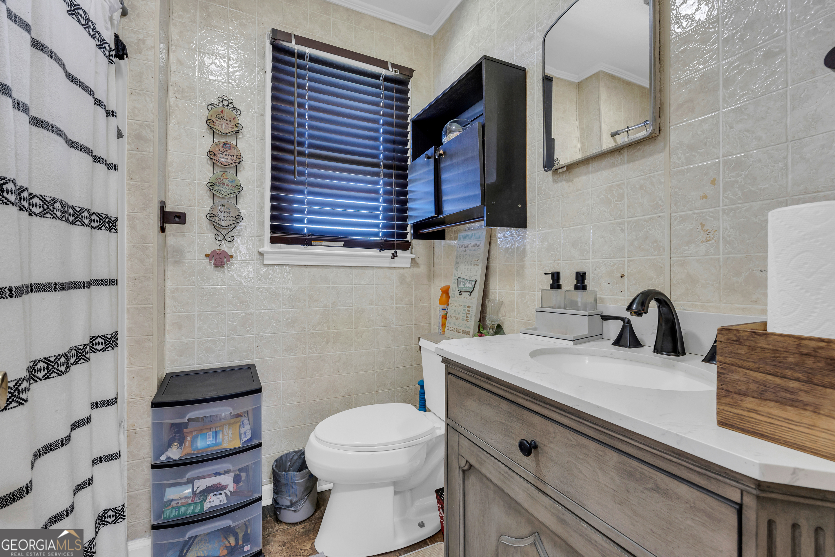 88 Maurice Way Lavonia, GA 30553 - Photo 20 of 65 a bathroom with a granite countertop toilet sink and mirror