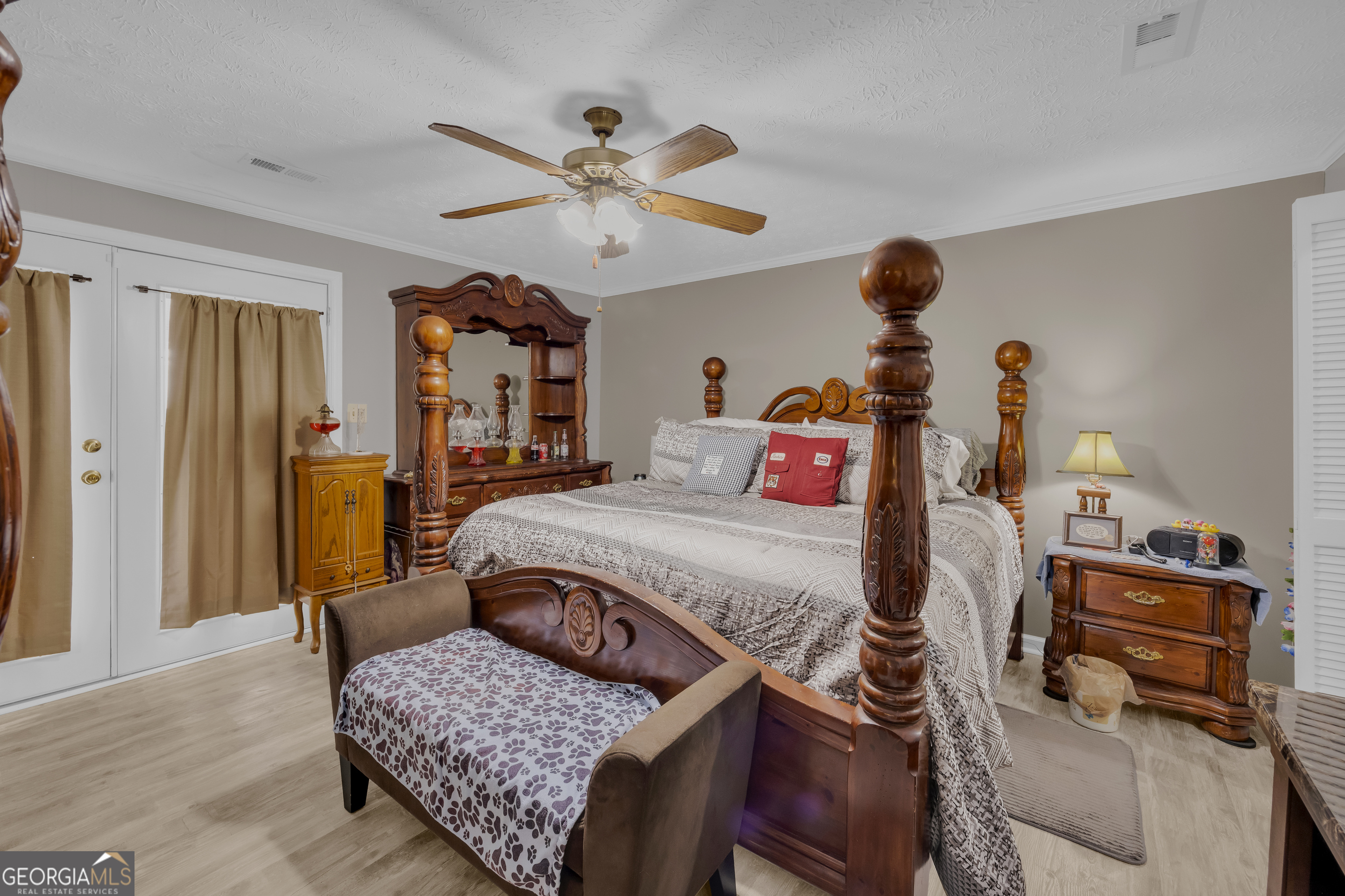 88 Maurice Way Lavonia, GA 30553 - Photo 25 of 65 a bedroom with a bed and dresser