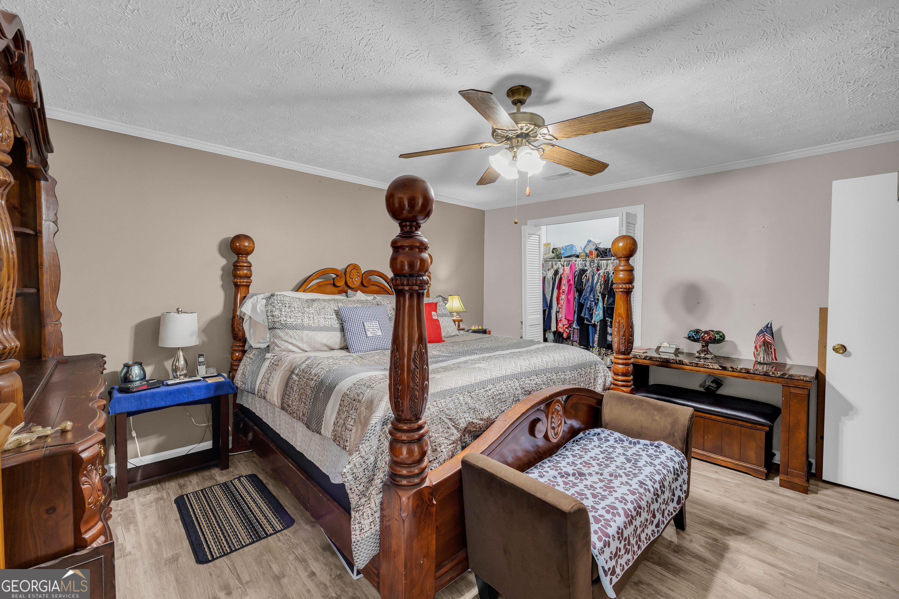 88 Maurice Way Lavonia, GA 30553 - Photo 26 of 65 a bedroom with furniture and a chandelier