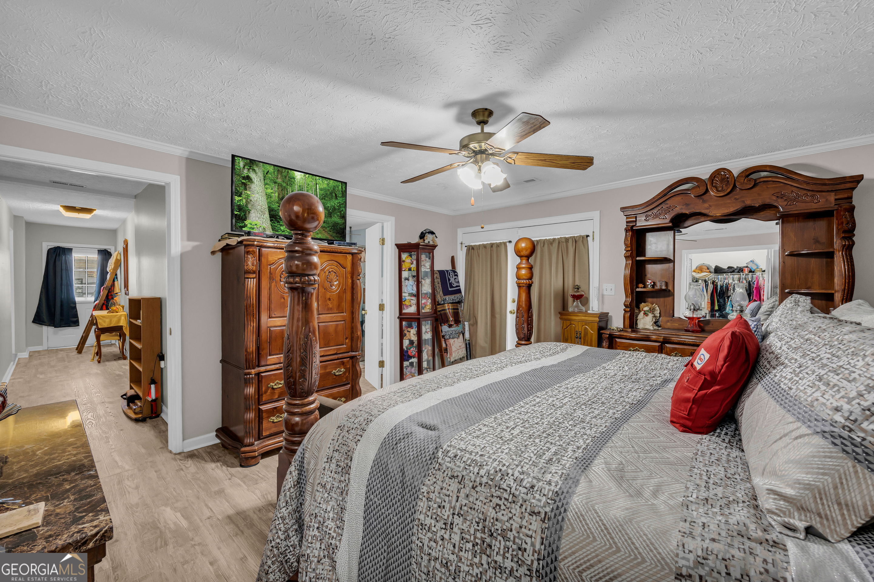 88 Maurice Way Lavonia, GA 30553 - Photo 28 of 65 a bed room with a bed and a walk in closet