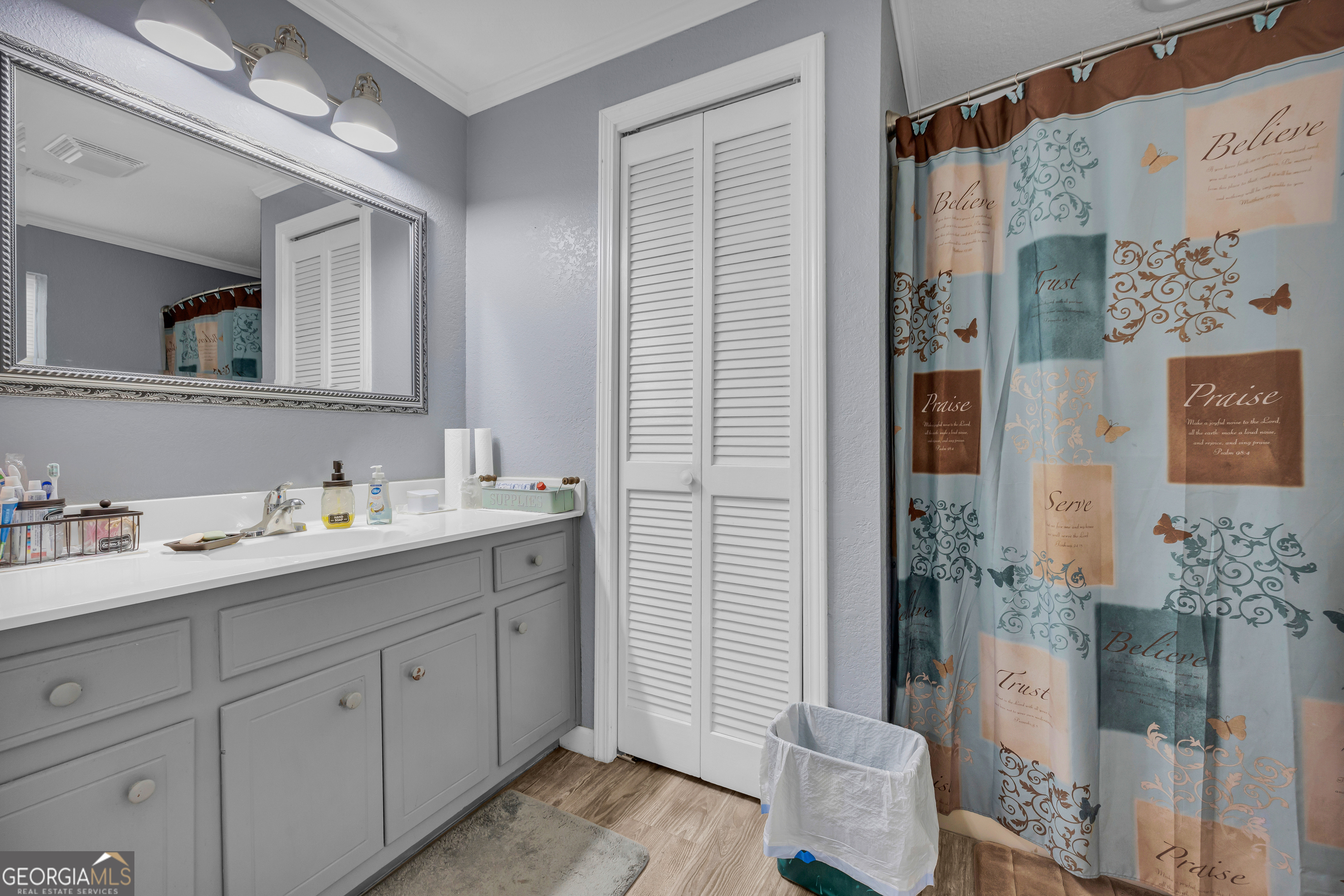 88 Maurice Way Lavonia, GA 30553 - Photo 30 of 65 a bathroom with a double vanity sink and mirror
