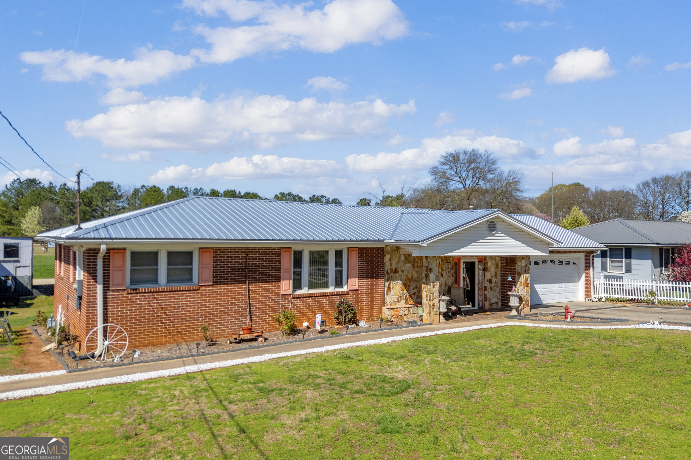 88 Maurice Way Lavonia, GA 30553 - Photo 3 of 65 a view of a house with swimming pool and a yard