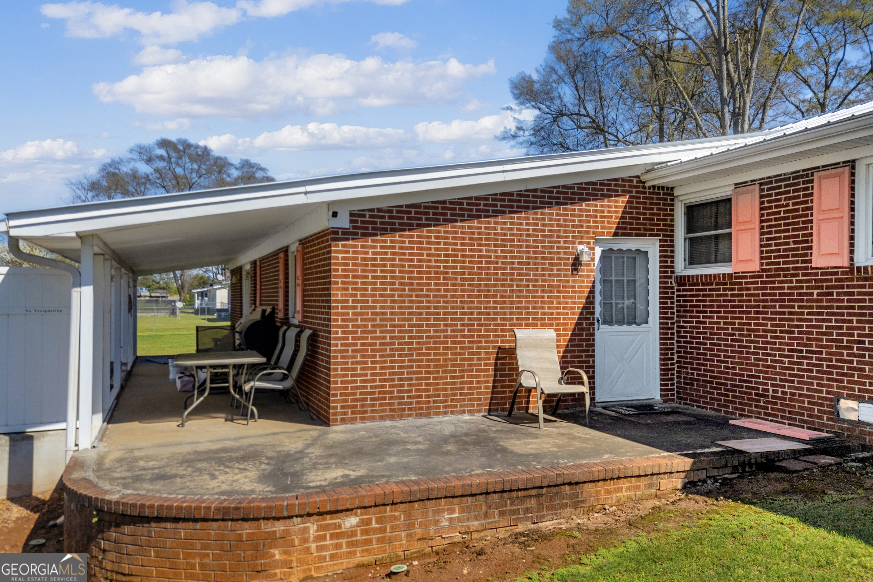 88 Maurice Way Lavonia, GA 30553 - Photo 32 of 65 a view of backyard with wheel chair