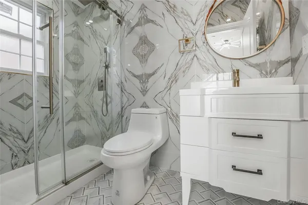 a bathroom with a toilet and a sink