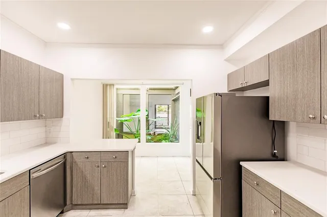 a view of a livingroom with wooden floor and a ceiling fan