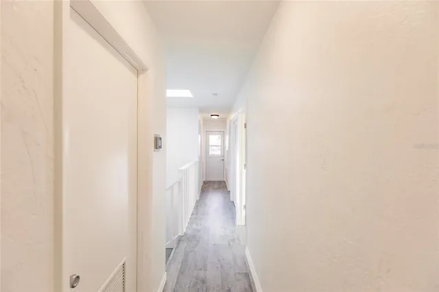 a spacious bathroom with a double vanity sink and a mirror