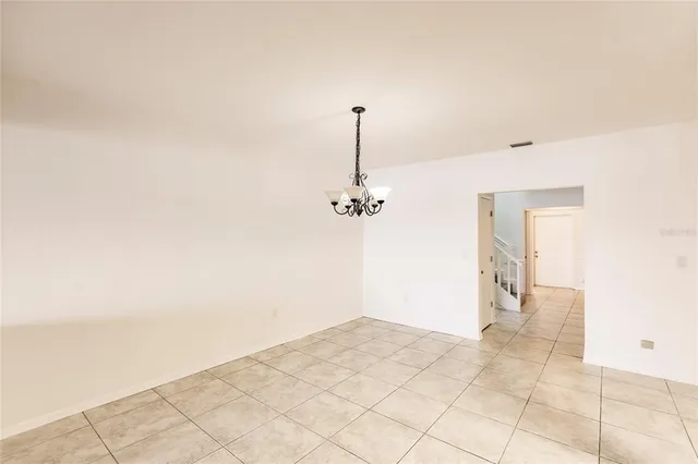 a kitchen with stainless steel appliances a refrigerator and a stove top oven