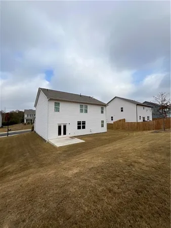 a house with trees in the background