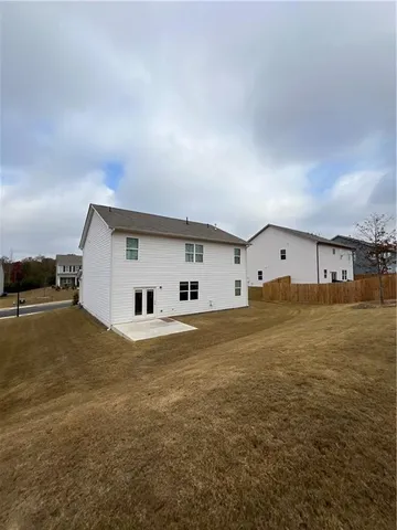 a house with trees in the background