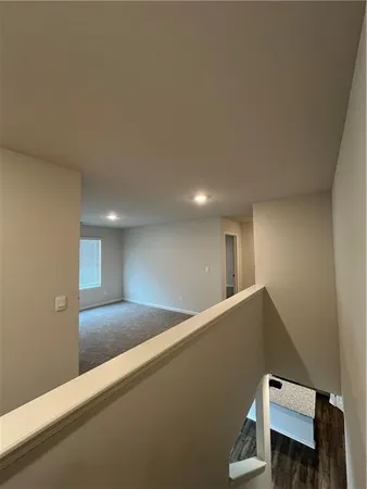 a view of a hallway with staircase