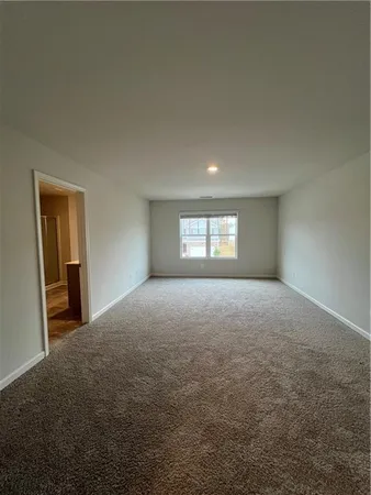 a view of empty room with windows