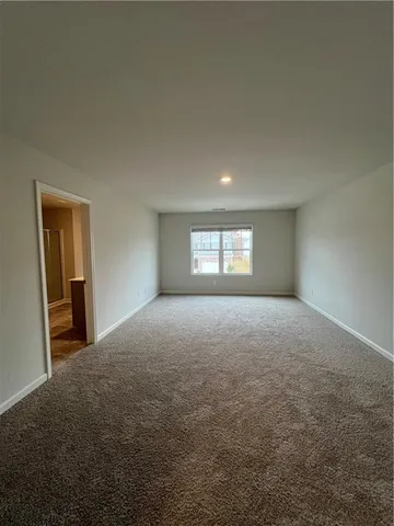 a view of empty room with windows