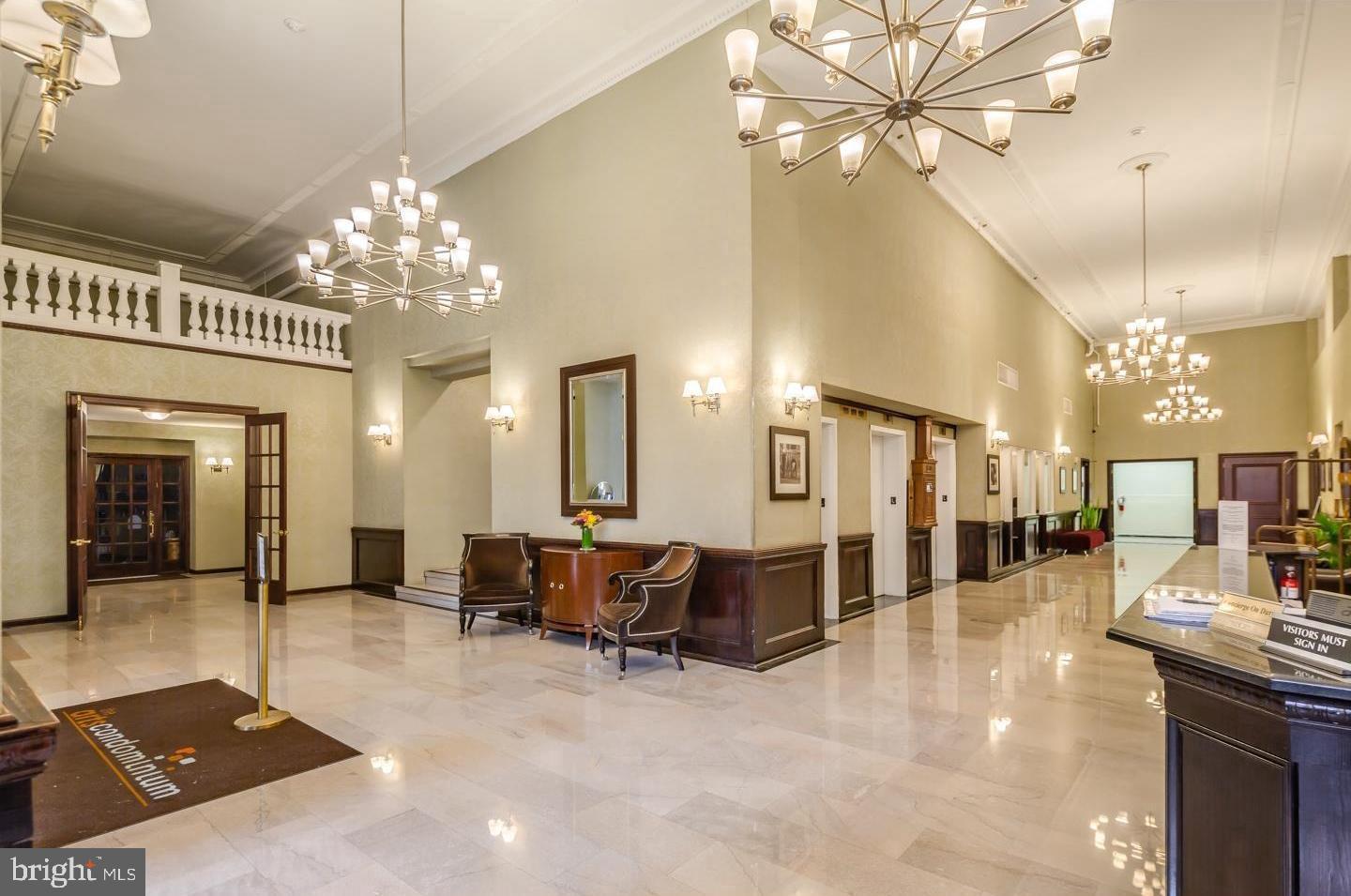 1324 Locust Street, Unit 412 Philadelphia, PA 19107 - Photo 2 of 20 a view of a dining room with furniture a chandelier and chandelier