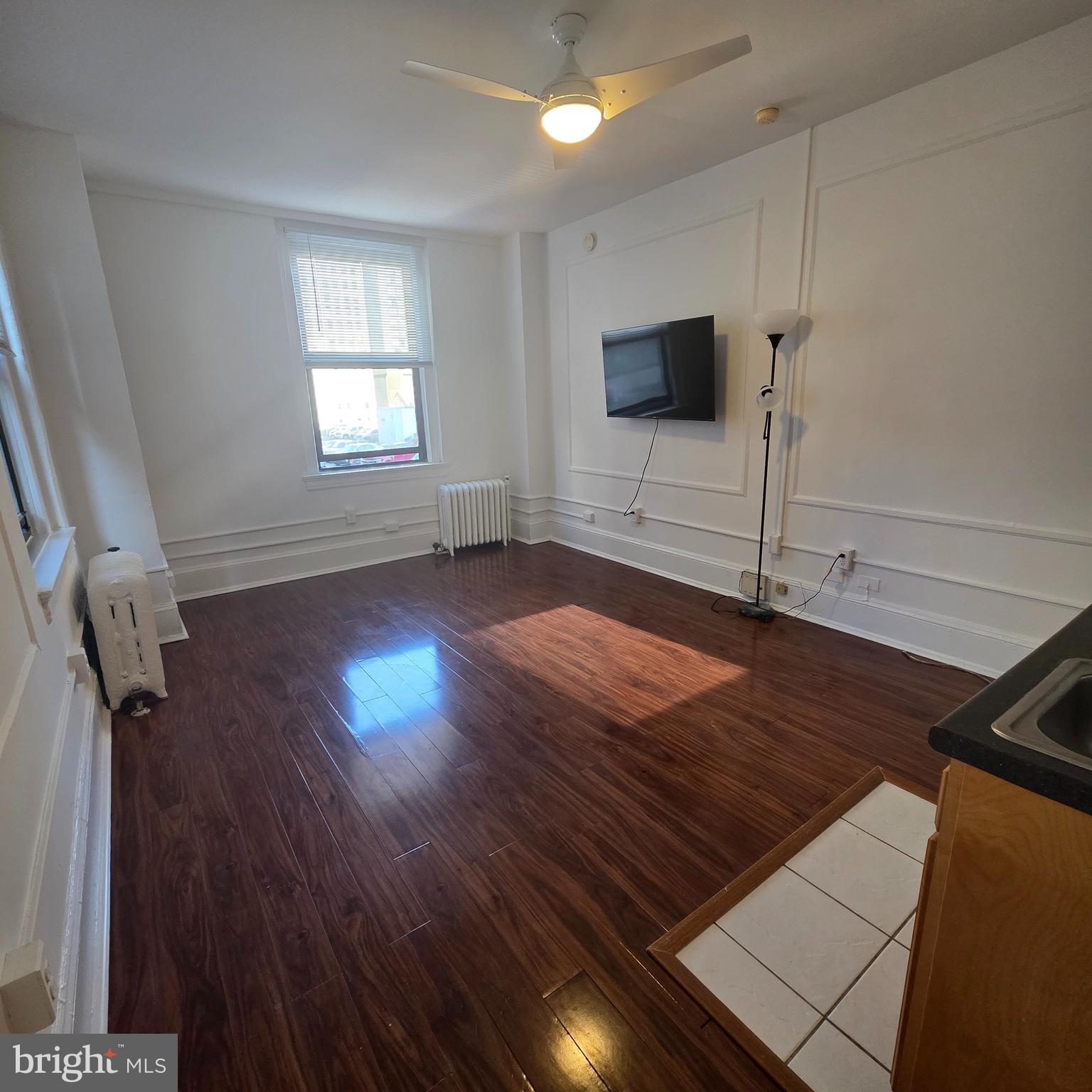 1324 Locust Street, Unit 412 Philadelphia, PA 19107 - Photo 8 of 20 a view of a livingroom with wooden floor