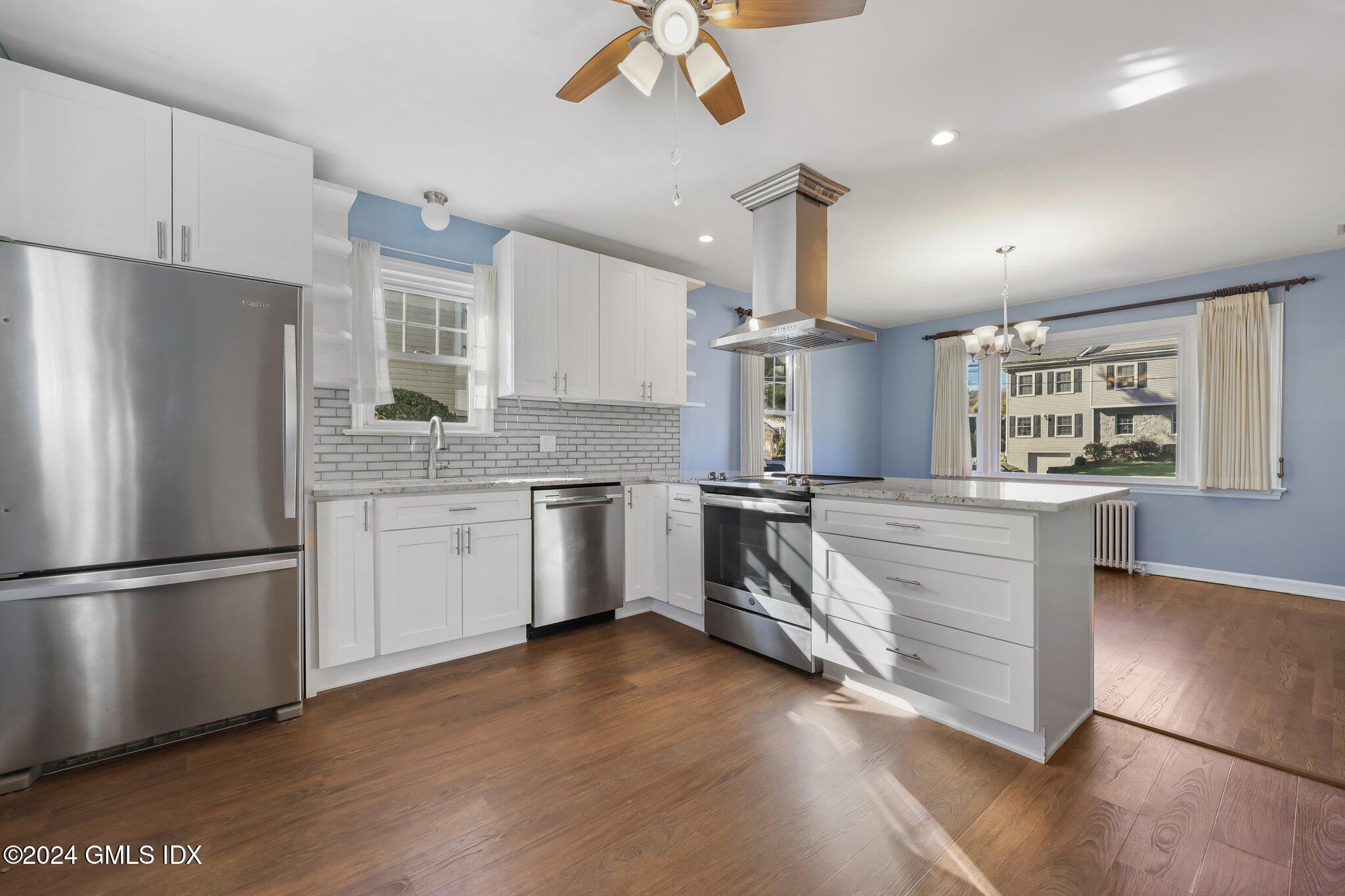 7 Hoover Road Riverside, CT 06878 - Photo 11 of 28 a kitchen with granite countertop a refrigerator and a sink