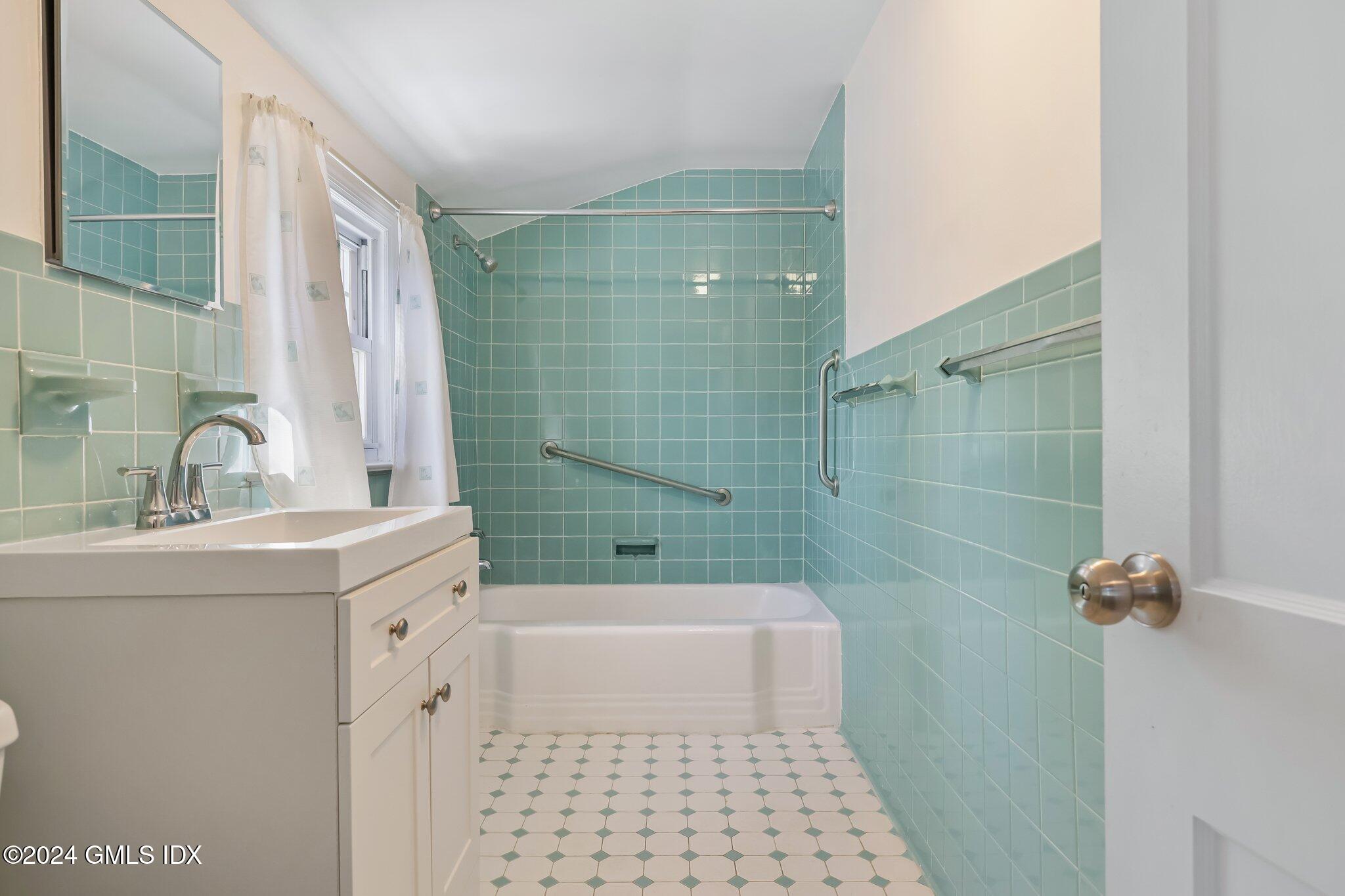 7 Hoover Road Riverside, CT 06878 - Photo 18 of 28 a bathroom with a sink a toilet and shower