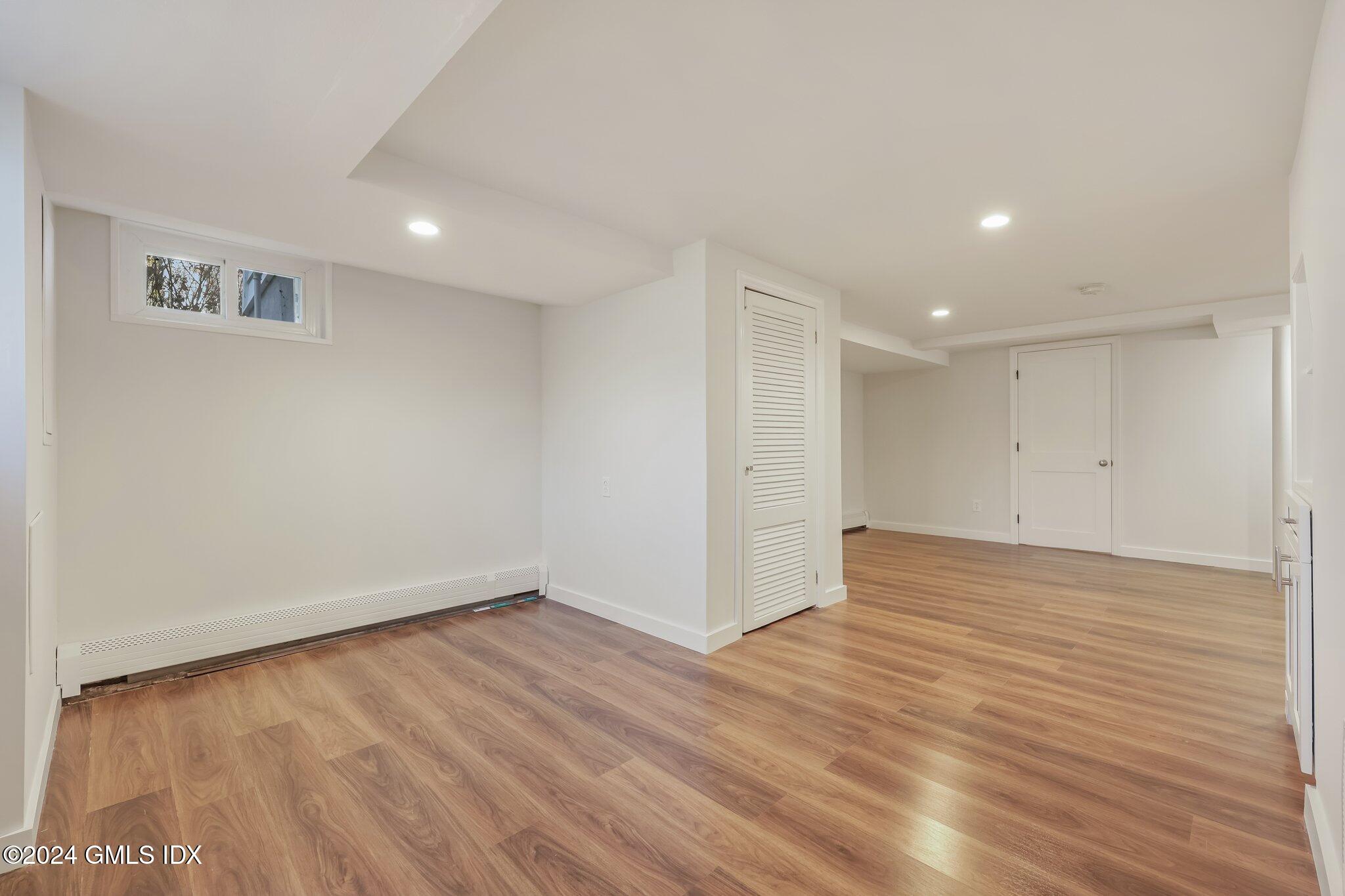 7 Hoover Road Riverside, CT 06878 - Photo 21 of 28 a view of an empty room with wooden floor