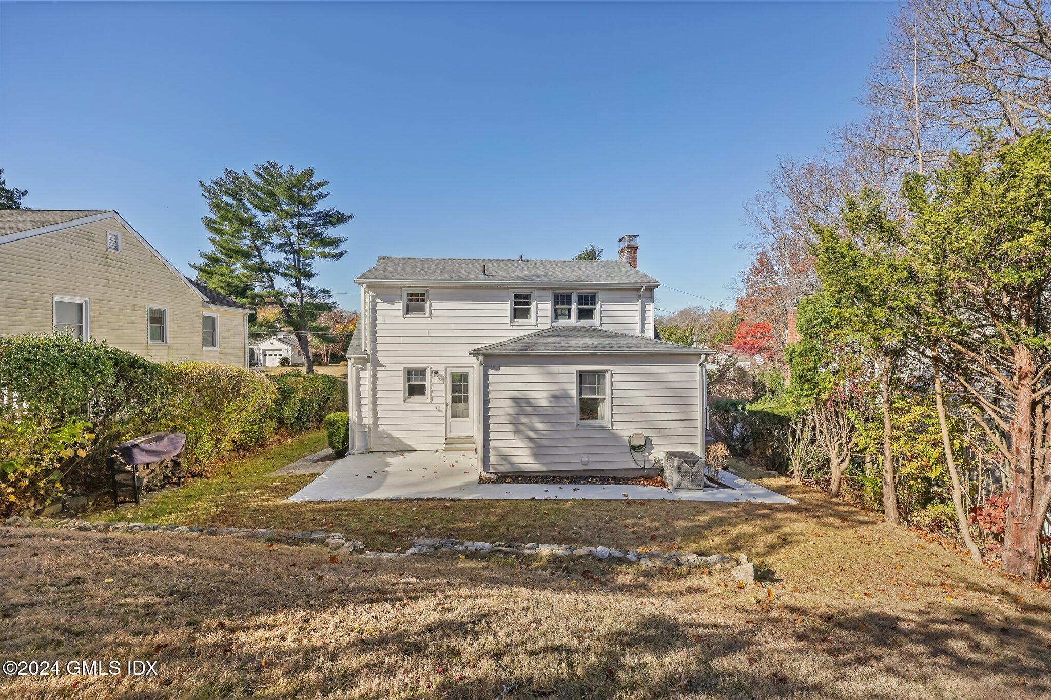 7 Hoover Road Riverside, CT 06878 - Photo 24 of 28 a front view of a house with a yard