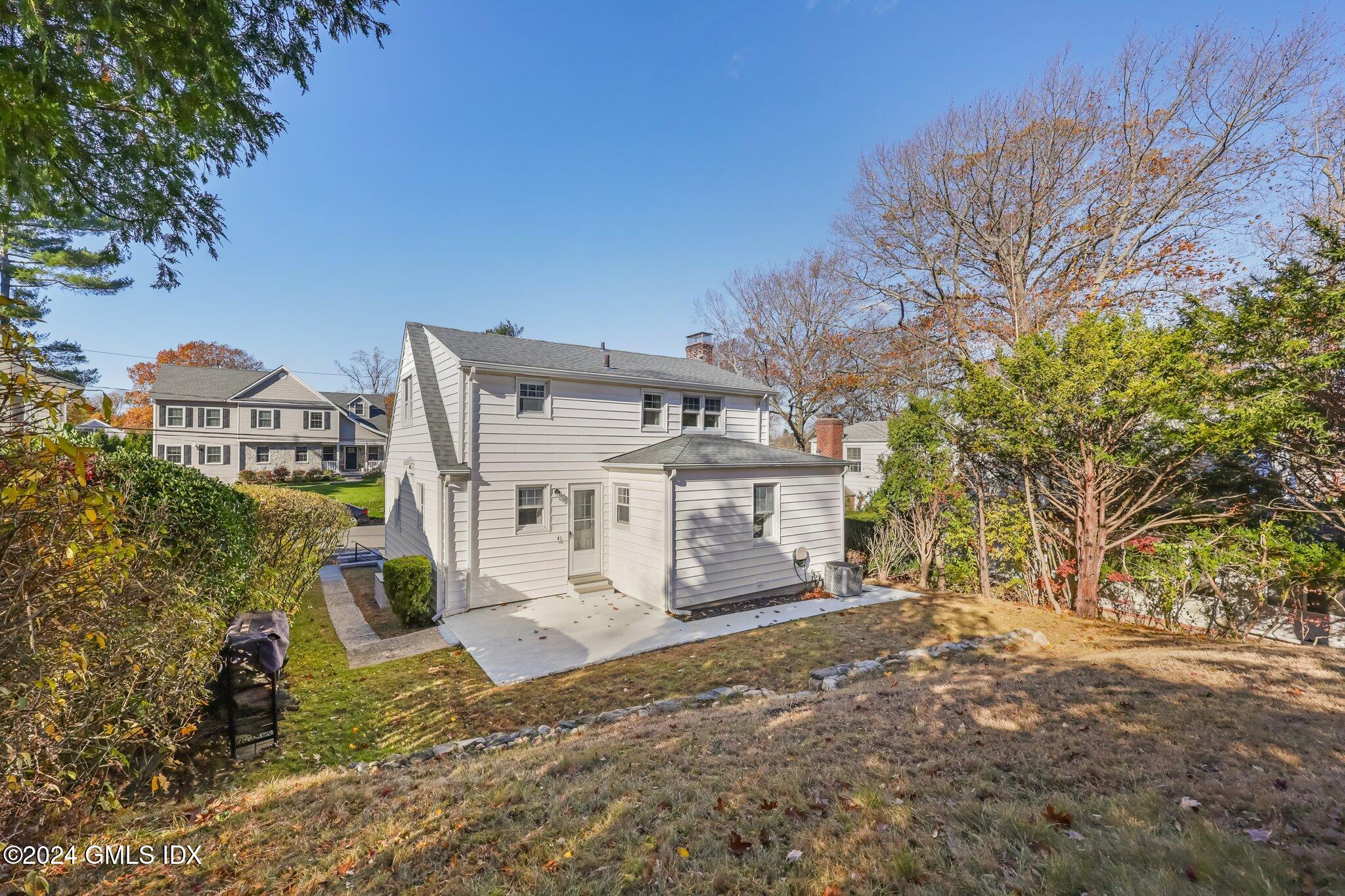 7 Hoover Road Riverside, CT 06878 - Photo 25 of 28 a front view of a house with a yard