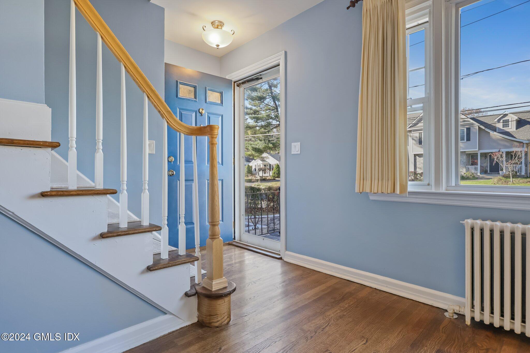 7 Hoover Road Riverside, CT 06878 - Photo 3 of 28 a view of an entryway with wooden floor and door