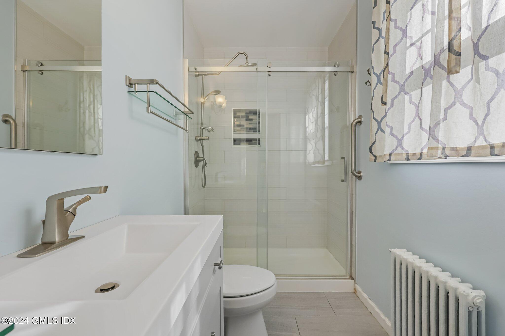 7 Hoover Road Riverside, CT 06878 - Photo 10 of 28 a bathroom with a sink a toilet and shower