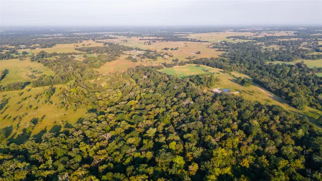 an aerial view of residential building and lake