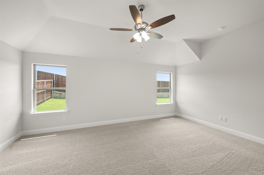 228 Shepards Street Godley, TX 76044 - Photo 7 of 27 an empty room with windows and fan