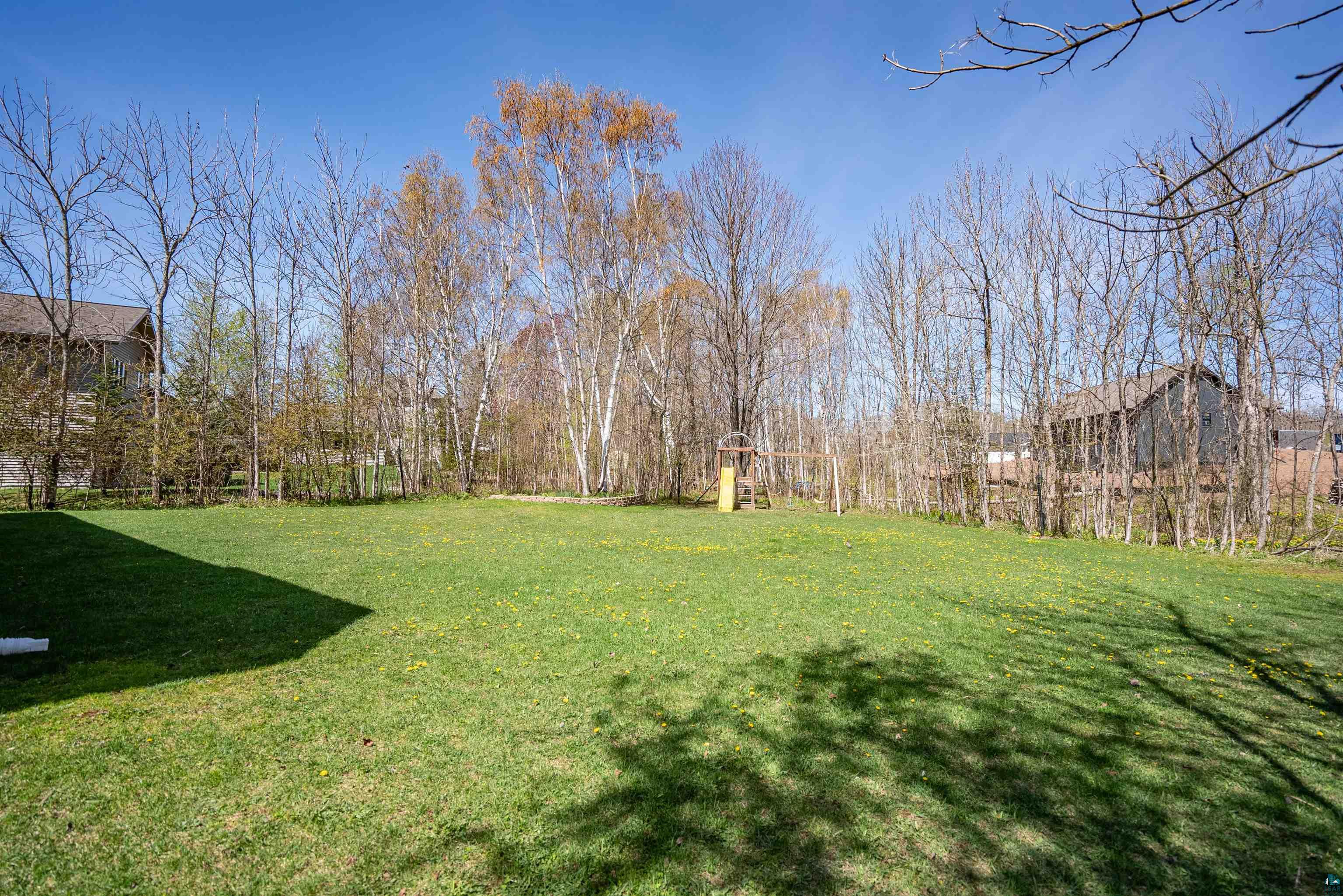 4809 Oak Ridge Drive Hermantown, MN 55811 - Photo 51 of 69 Expansive lawn area with mature trees forming a natural border
