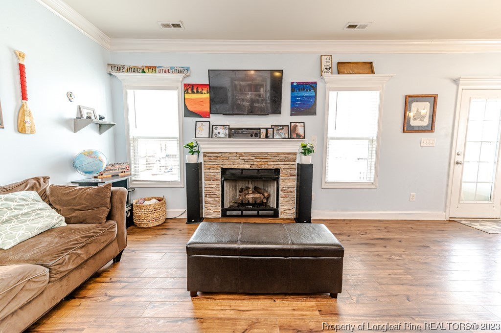 100 Lothian Ln. Cameron, NC 28326 - Photo 18 of 45 a living room with furniture and a fireplace