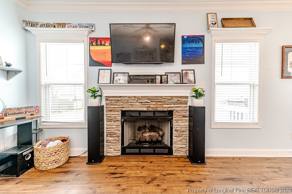 100 Lothian Ln. Cameron, NC 28326 - Photo 19 of 45 a living room with furniture and a fireplace
