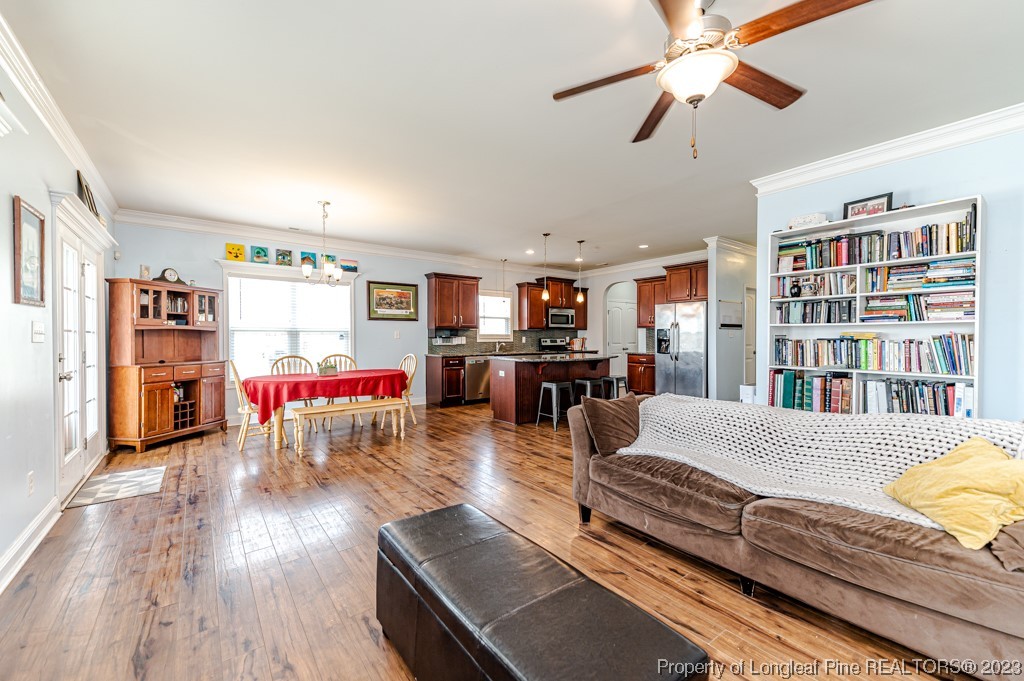 100 Lothian Ln. Cameron, NC 28326 - Photo 25 of 45 a living room with furniture and a book shelf