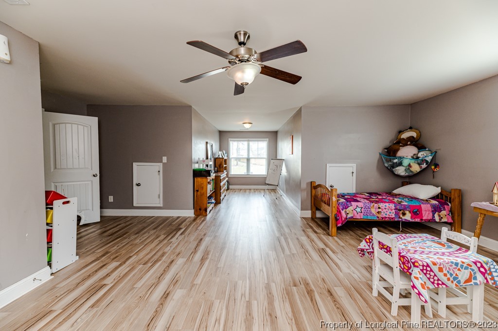 100 Lothian Ln. Cameron, NC 28326 - Photo 29 of 45 a living room with furniture and wooden floor