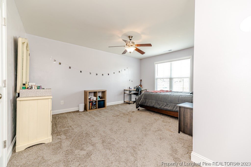 100 Lothian Ln. Cameron, NC 28326 - Photo 33 of 45 a living room with furniture and a fireplace
