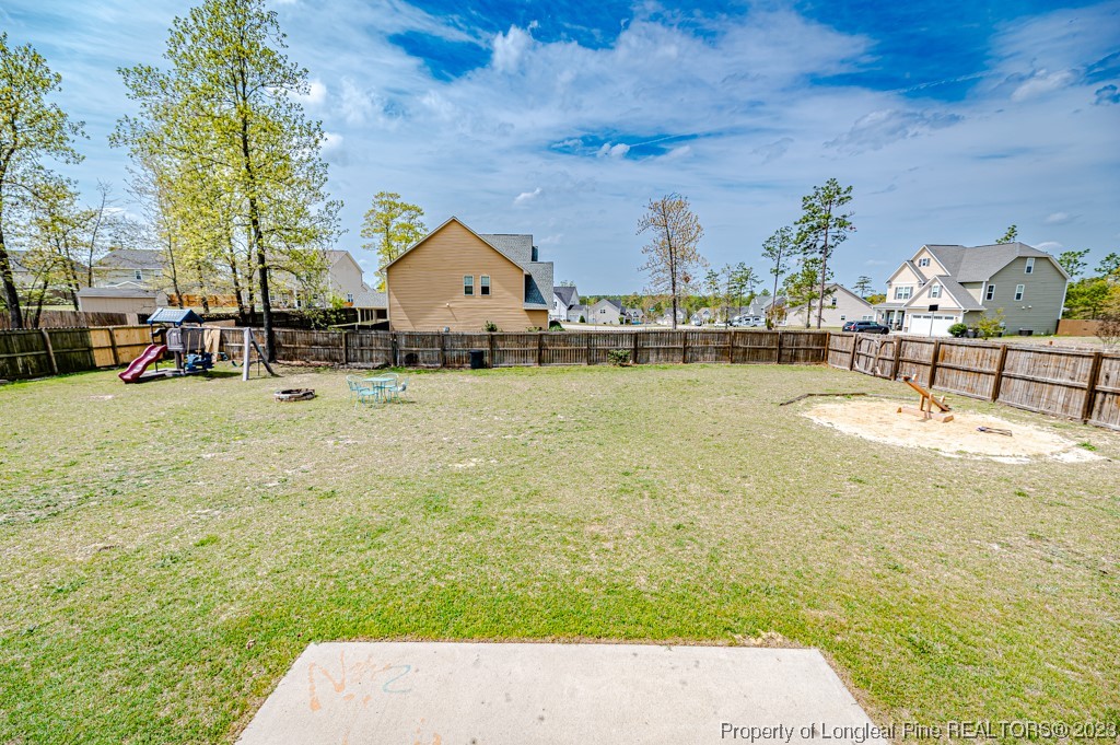 100 Lothian Ln. Cameron, NC 28326 - Photo 36 of 45 a view of swimming pool with lawn chairs and iron fence