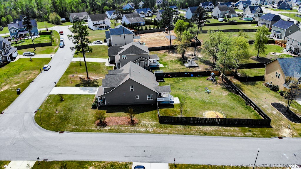100 Lothian Ln. Cameron, NC 28326 - Photo 43 of 45 an aerial view of a house with a yard basket ball court and outdoor seating