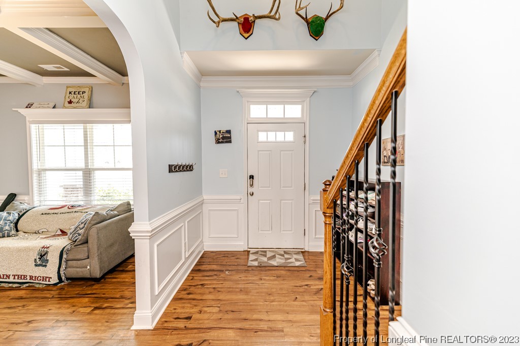 100 Lothian Ln. Cameron, NC 28326 - Photo 6 of 45 a view of a bedroom with wooden floor and windows