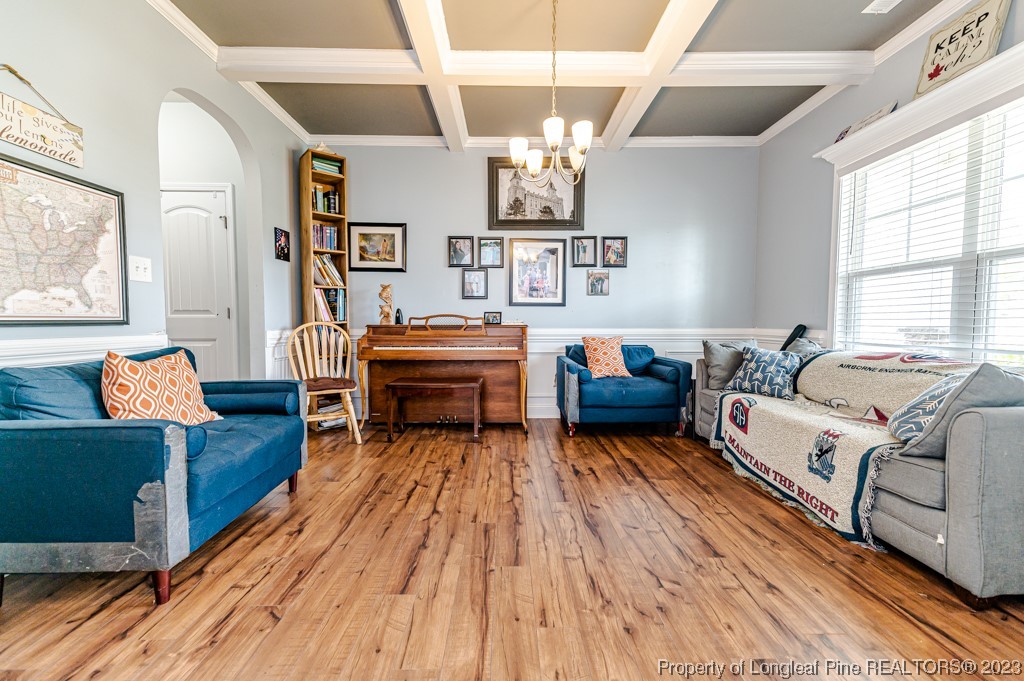 100 Lothian Ln. Cameron, NC 28326 - Photo 7 of 45 a living room with furniture and a chandelier
