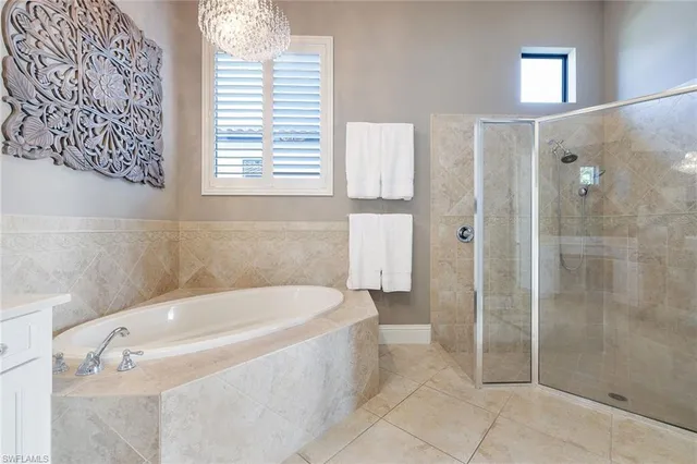 a bathroom with a bathtub and shower