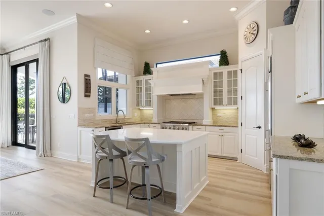 a kitchen that has a table and chairs in it