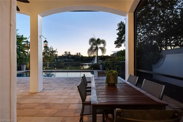 a view of house with backyard outdoor seating and hardwood